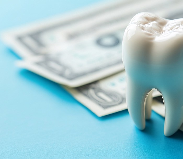 Nose-to-neck ¾ profile view of woman smiling with perfect teeth